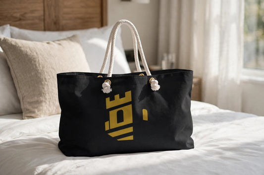 Monogram luxe weekender bag staged on a hotel bed