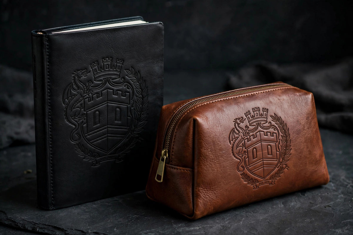 The Sovereign Crest — Leather Set Two: engraved journal in Black/Gold with the chestnut leather toiletry bag