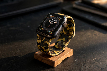 Citadel Camo Apple Watch strap on a wooden watch stand