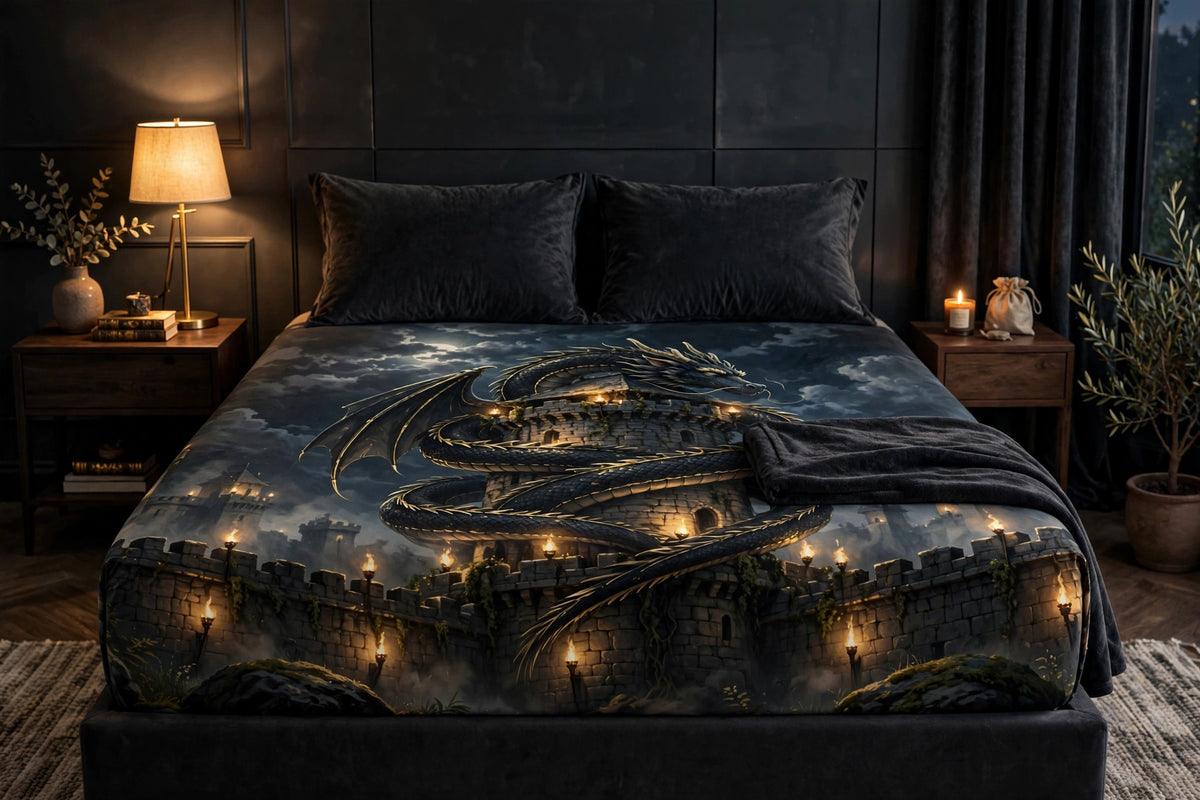 Dragon's Rest fitted sheet on a styled bed — black dragon coiled around a fortress tower under a full moon