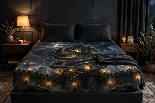 Dragon's Rest fitted sheet on a styled bed — black dragon coiled around a fortress tower under a full moon