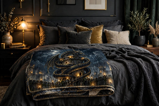 Dragon's Rest quilt folded on a styled bed — black dragon coiled around a fortress tower under a full moon