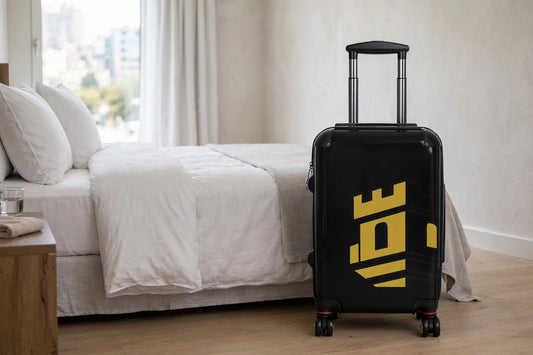 Monogram travel suitcase standing in a hotel room