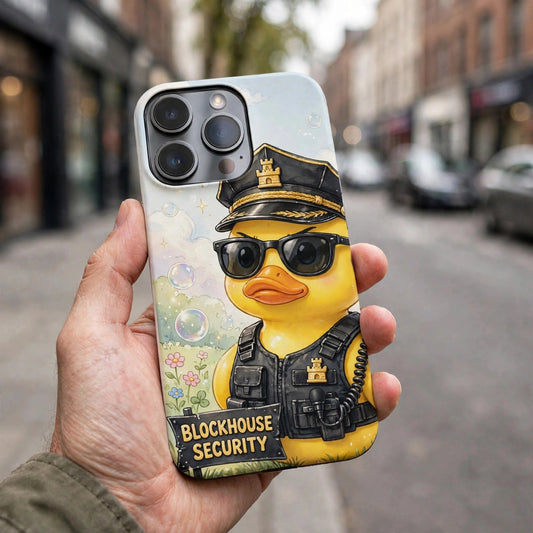 Rubber Duck Security premium snap phone case on a phone held in a hand on a street, showing the security duck design on the case back