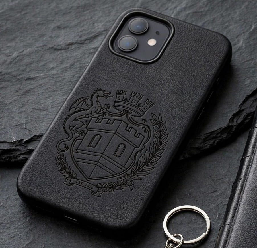 Sovereign Crest black engraved leather phone case on dark slate