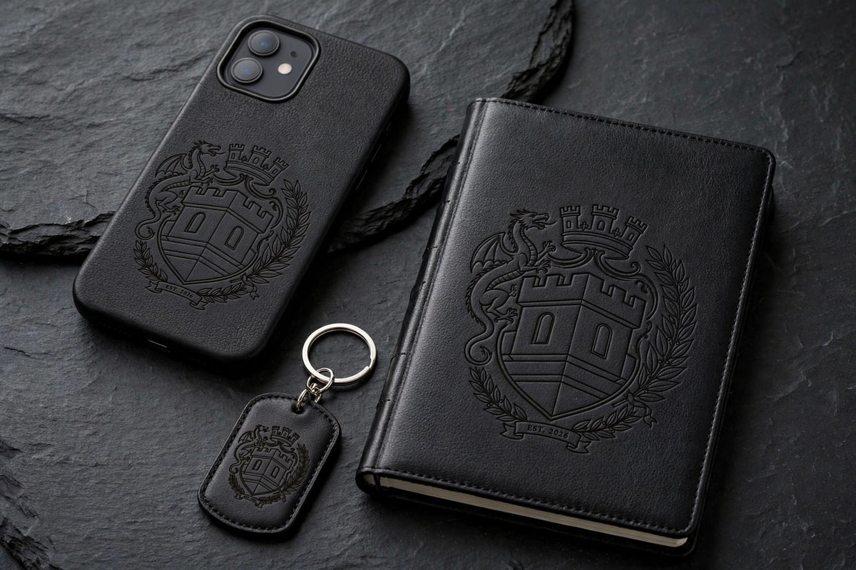 The Sovereign Crest — Leather Set One: engraved leather phone case, engraved journal in Black/Gold and engraved dog tag