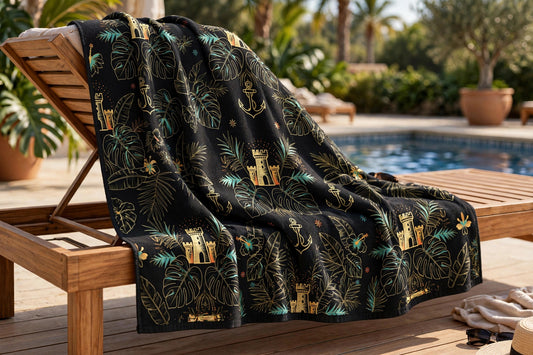 Beach towel with new botanical garden design draped on a lounge chair